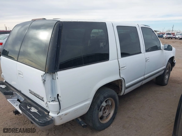 1997 Chevrolet Tahoe with VIN 1GNEK13RXVJ389741, listed as a IAAI auction lot 41518277 with 124,870 mi miles. Bid and sale history available at carsss.com. Image 4.
