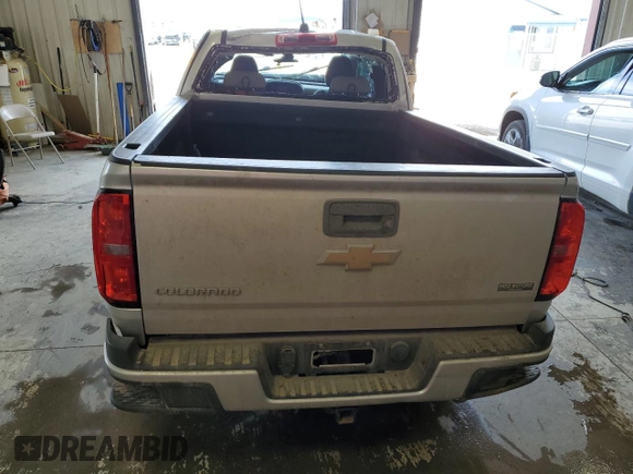 2015 Chevrolet Colorado 4WD WT with VIN 1GCHTAE36F1213461, listed as a Copart auction lot 54248414 with 100,052 mi miles and Salvage Title. Bid and sale history available at DreamBid. Image 6.