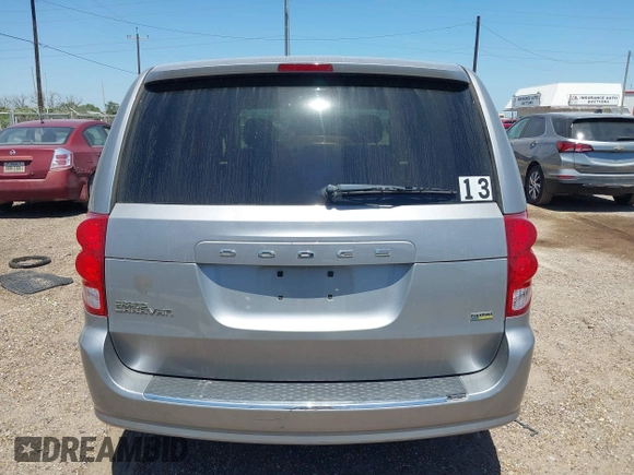 2013 Dodge Grand Caravan SE with VIN 2C4RDGBG0DR702913, listed as a IAAI auction lot 42007786 with 163,981 mi miles and . Bid and sale history available at DreamBid. Image 16.