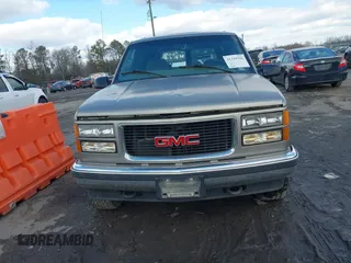 1999 GMC Yukon with VIN 1GKEK13R8XJ804104, listed as a IAAI auction lot 41359701 with 296,522 mi miles. Bid and sale history available at carsss.com. Image 12.