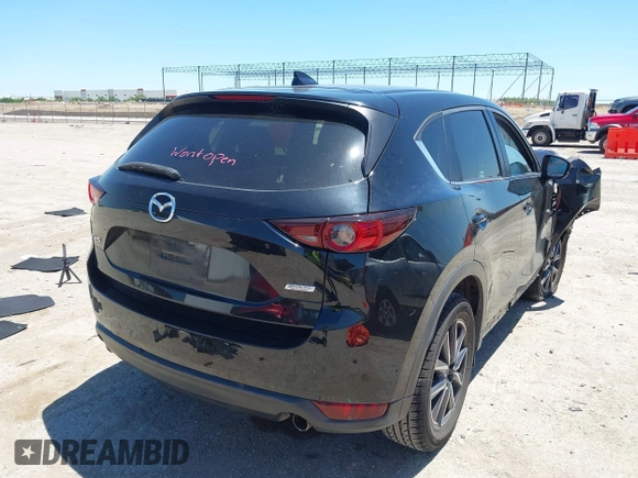 2018 Mazda CX-5 Touring z VIN JM3KFACM3J1339074, wystawiony jako IAAI lot #42317039 z przebiegiem 82 799 mil mil oraz . Historia ofert i sprzedaży dostępna na DreamBid. Obrazek 4.