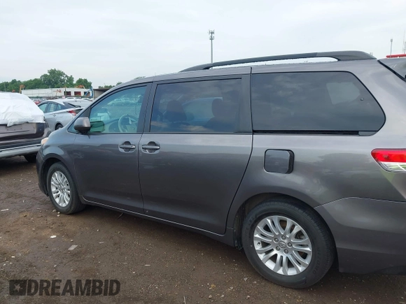 2014 Toyota Sienna XLE with VIN 5TDYK3DC0ES496716, listed as a IAAI auction lot 42494549 with 158,645 mi miles and . Bid and sale history available at DreamBid. Image 14.