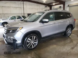 2017 Honda Pilot Touring with VIN 5FNYF6H92HB093950, listed as a Copart auction lot 59382395 with 143,359 mi miles and Salvage title. Bid and sale history available at DreamBid. Image 1.