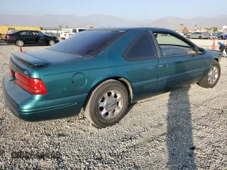 1997 Ford Thunderbird LX with VIN 1FALP62W4VH170423, listed as a Copart auction lot 83379614 with 93,117 mi miles and Salvage Title. Bid and sale history available at DreamBid. Image 3.