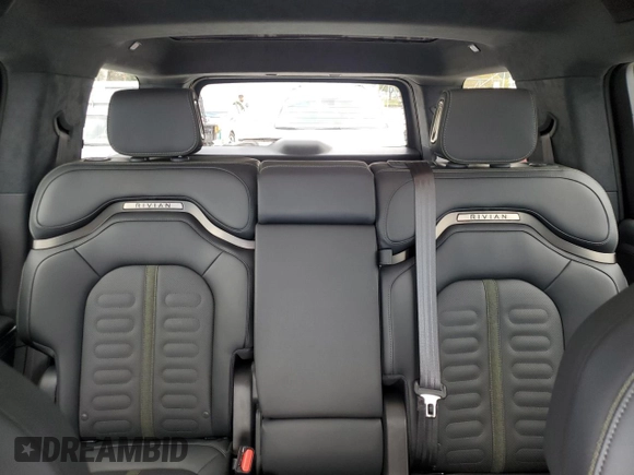 2025 Rivian R1S Adventure z VIN 7PDSGBBA2SN052590, wystawiony jako Copart lot #48431075 z przebiegiem 11 065 mil mil oraz Szkody całkowita. Historia ofert i sprzedaży dostępna na DreamBid. Obrazek 10.