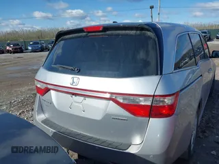2011 Honda Odyssey Touring with VIN 5FNRL5H92BB049901, listed as a IAAI auction lot 41985224 with 101,957 mi miles and . Bid and sale history available at DreamBid. Image 16.