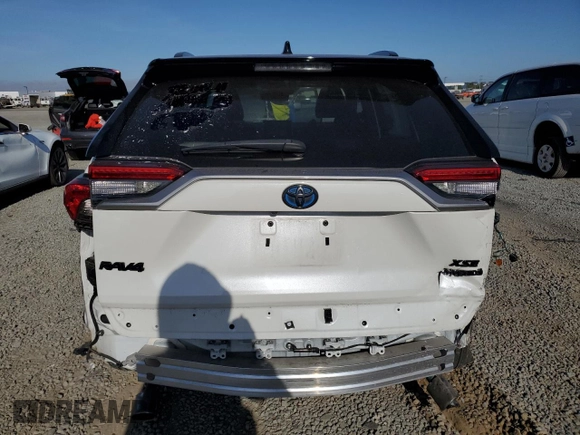 2021 Toyota RAV4 Hybrid XSE with VIN 2T3E6RFV1MW018990, listed as a Copart auction lot 64043865 with 55,938 mi miles and Salvage title. Bid and sale history available at DreamBid. Image 6.