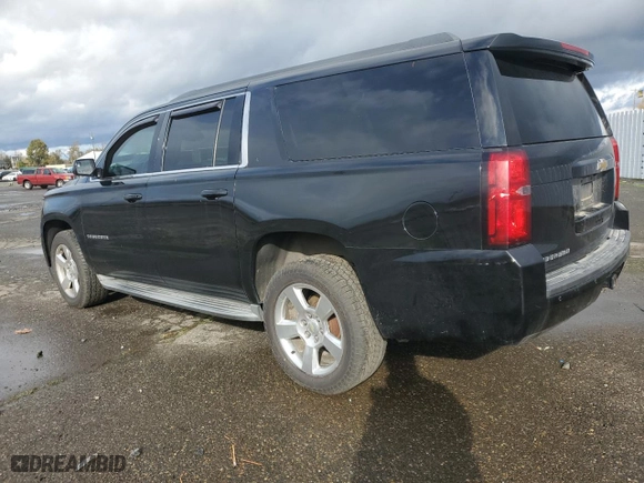 2015 Chevrolet Suburban LT with VIN 1GNSKJKC4FR202349, listed as a Copart auction lot 79274044 with 222,792 mi miles and Salvage Title. Bid and sale history available at carsss.com. Image 2.
