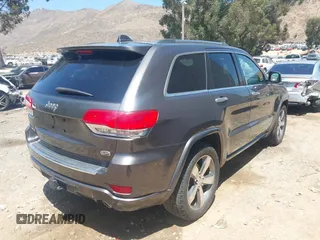 2015 Jeep Grand Cherokee Overland with VIN 1C4RJFCG7FC839778, listed as a IAAI auction lot 42490111 with 160,040 mi miles and . Bid and sale history available at DreamBid. Image 4.