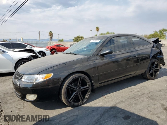 2000 Toyota Solara SE with VIN 2T1CF28P0YC337293, listed as a Copart auction lot 70659044 with 214,172 mi miles and Salvage Title. Bid and sale history available at DreamBid. Image 1.