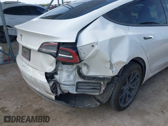 2019 Tesla Model 3 Mid Range with VIN 5YJ3E1EA6KF464615, listed as a IAAI auction lot 41306600 with 79,478 mi miles and . Bid and sale history available at DreamBid. Image 6.