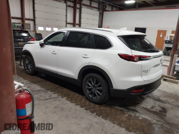 2022 Mazda CX-9 Sport z VIN JM3TCBBYXN0603653, wystawiony jako IAAI lot #42325893 z przebiegiem 57 480 mil mil oraz . Historia ofert i sprzedaży dostępna na DreamBid. Obrazek 3.