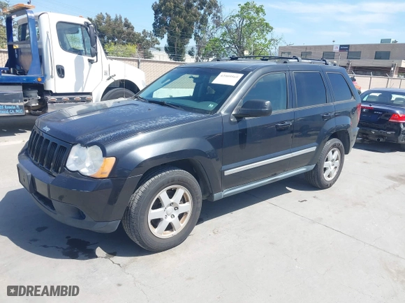 2010 Jeep Grand Cherokee Laredo with VIN 1J4PR4GK2AC104857, listed as a IAAI auction lot 42009569 with 131,986 mi miles. Bid and sale history available at carsss.com. Image 2.