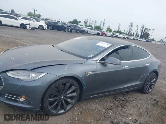 2013 Tesla Model S with VIN 5YJSA1AG5DFP13149, listed as a IAAI auction lot 42116437 with 140,999 mi miles. Bid and sale history available at carsss.com. Image 15.