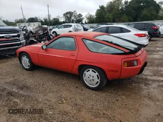 1986 Porsche 928 z VIN WP0JB0924GS860470, wystawiony jako Copart lot #79404034 z przebiegiem 77 247 mil mil oraz Tytuł czysty. Historia ofert i sprzedaży dostępna na DreamBid. Obrazek 2.