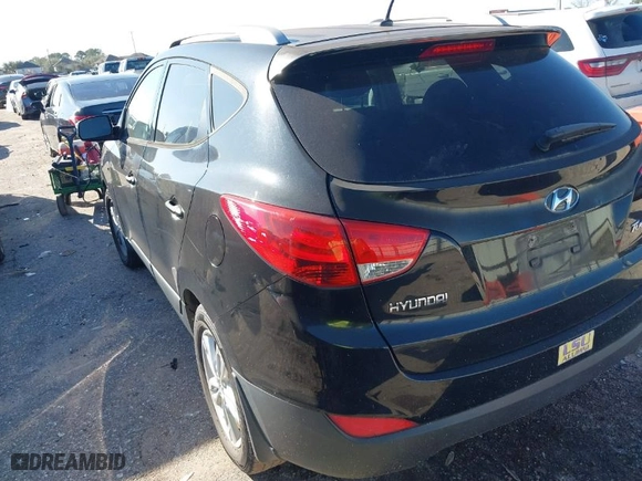 2013 Hyundai Tucson GLS with VIN KM8JU3AC7DU636203, listed as a IAAI auction lot 41673910 with 115,584 mi miles. Bid and sale history available at carsss.com. Image 3.