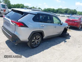 2022 Toyota RAV4 Hybrid XLE Premium with VIN JTMB6RFV1ND063963, listed as a IAAI auction lot 42550907 with 35,012 mi miles and . Bid and sale history available at DreamBid. Image 4.