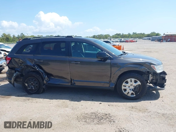 2017 Dodge Journey SE with VIN 3C4PDCAB2HT579852, listed as a IAAI auction lot 42008261 with 112,234 mi miles and . Bid and sale history available at DreamBid. Image 13.