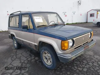 1986 Isuzu Trooper z VIN JACCH55L1G7801560, wystawiony jako IAAI lot #41878592 z przebiegiem 139 020 mil mil oraz . Historia ofert i sprzedaży dostępna na DreamBid. Obrazek 1.