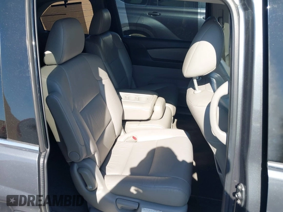 2011 Honda Odyssey Touring with VIN 5FNRL5H96BB009580, listed as a IAAI auction lot 42202595 with Not provided miles and . Bid and sale history available at DreamBid. Image 8.