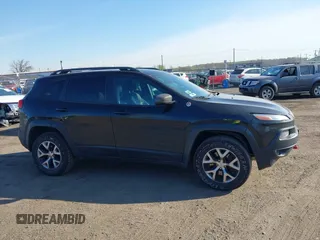 2014 Jeep Cherokee Trailhawk with VIN 1C4PJMBS5EW280598, listed as a IAAI auction lot 42079597 with 171,564 mi miles. Bid and sale history available at carsss.com. Image 13.