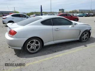 2006 Hyundai Tiburon GT z VIN KMHHN65F06U203701, wystawiony jako Copart lot #52374135 z przebiegiem 90 796 mil mil oraz Szkody całkowita. Historia ofert i sprzedaży dostępna na DreamBid. Obrazek 3.