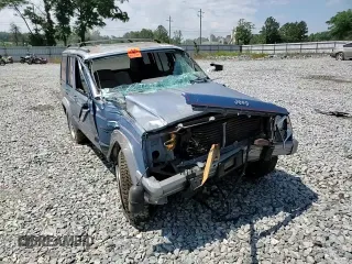 1991 Jeep Cherokee z VIN 1J4FJ58S0ML519252, wystawiony jako Copart lot #55458005 z przebiegiem 152 129 mil mil oraz Szkoda całkowita • Salvage title. Historia ofert i sprzedaży dostępna na DreamBid. Obrazek 13.