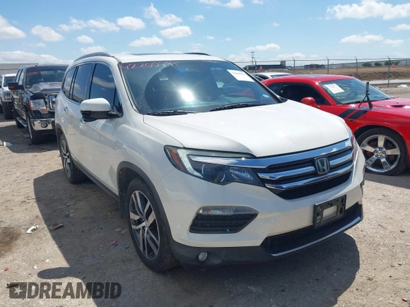 2017 Honda Pilot Touring with VIN 5FNYF6H92HB054145, listed as a IAAI auction lot 42200391 with 70,096 mi miles and . Bid and sale history available at DreamBid. Image 1.