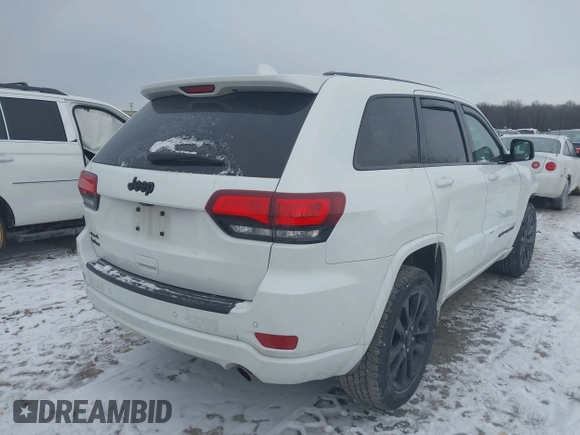 2018 Jeep Grand Cherokee Laredo E with VIN 1C4RJFAG1JC499457, listed as a IAAI auction lot 41379459 with 127,344 mi miles and . Bid and sale history available at DreamBid. Image 4.