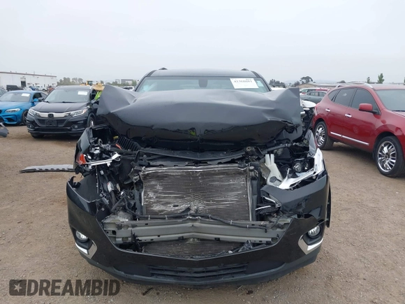2018 Chevrolet Traverse LT Cloth z VIN 1GNERGKW4JJ127889, wystawiony jako IAAI lot #42368681 z przebiegiem 65 438 mil mil oraz . Historia ofert i sprzedaży dostępna na DreamBid. Obrazek 12.