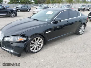 2013 Jaguar XF V6 SC with VIN SAJWJ0EF1D8S81898, listed as a IAAI auction lot 41951634 with 113,697 mi miles. Bid and sale history available at carsss.com. Image 2.