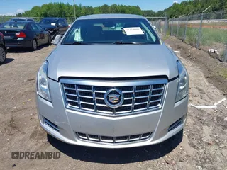 2014 Cadillac XTS Luxury z VIN 2G61M5S31E9199170, wystawiony jako IAAI lot #42150000 z przebiegiem 135 414 mil mil oraz . Historia ofert i sprzedaży dostępna na DreamBid. Obrazek 12.