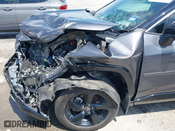 2021 Toyota RAV4 Hybrid XSE with VIN 2T3E6RFV8MW026973, listed as a IAAI auction lot 42052289 with 94,857 mi miles and . Bid and sale history available at DreamBid. Image 6.