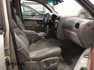 2003 GMC Envoy SLT with VIN 1GKDT13S932395367, listed as a IAAI auction lot 41544810 with 142,012 mi miles. Bid and sale history available at carsss.com. Image 5.