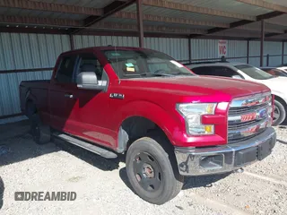 2015 Ford F-150 XLT with VIN 1FTFX1EF7FFA94960, listed as a IAAI auction lot 40268057 with 143,717 mi miles. Bid and sale history available at carsss.com. Image 1.