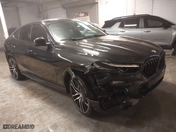2021 BMW X6 xDrive40i with VIN 5UXCY6C03M9E61703, listed as a IAAI auction lot 41602401 with 1 mi miles. Bid and sale history available at carsss.com. Image 1.