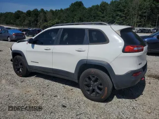 2015 Jeep Cherokee Trailhawk with VIN 1C4PJMBS0FW705288, listed as a Copart auction lot 61796275 with 133,874 mi miles and Salvage title. Bid and sale history available at DreamBid. Image 2.