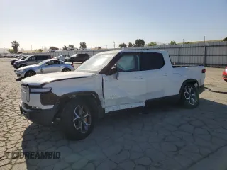 2022 Rivian R1T Adventure z VIN 7FCTGAAA9NN009189, wystawiony jako Copart lot #56009235 z przebiegiem 28 994 mil mil oraz Szkoda całkowita • Salvage title. Historia ofert i sprzedaży dostępna na DreamBid. Obrazek 1.