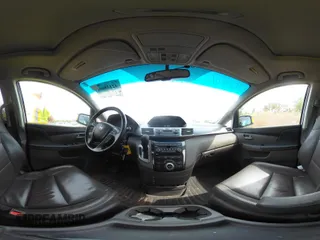 2012 Honda Odyssey Touring with VIN 5FNRL5H92CB055473, listed as a IAAI auction lot 42128601 with 163,901 mi miles. Bid and sale history available at carsss.com. Image 20.