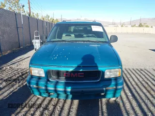 1996 GMC Jimmy SL with VIN 1GKDT13W6T2505181, listed as a IAAI auction lot 41392669 with 213,728 mi miles. Bid and sale history available at carsss.com. Image 6.