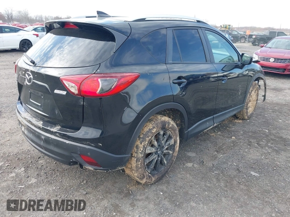 2016 Mazda CX-5 Touring with VIN JM3KE4CY7G0602267, listed as a IAAI auction lot 41854213 with 134,170 mi miles and . Bid and sale history available at carsss.com. Image 4.