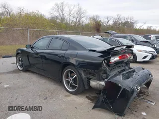 2014 Dodge Charger SE with VIN 2C3CDXBG2EH187978, listed as a IAAI auction lot 41246875 with 106,635 mi miles and . Bid and sale history available at DreamBid. Image 3.