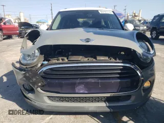 2016 MINI Hardtop 4 Door with VIN WMWXU1C59G2D11117, listed as a Copart auction lot 65191715 with 121,633 mi miles and Salvage title. Bid and sale history available at DreamBid. Image 5.