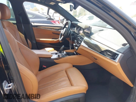 2018 BMW 5 Series 530i with VIN WBAJA5C51JG898278, listed as a IAAI auction lot 42595701 with 96,777 mi miles and . Bid and sale history available at DreamBid. Image 5.