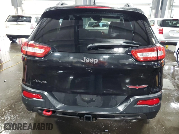 2014 Jeep Cherokee Trailhawk with VIN 1C4PJMBSXEW187981, listed as a Copart auction lot 56711885 with 157,317 mi miles and Salvage title. Bid and sale history available at DreamBid. Image 6.