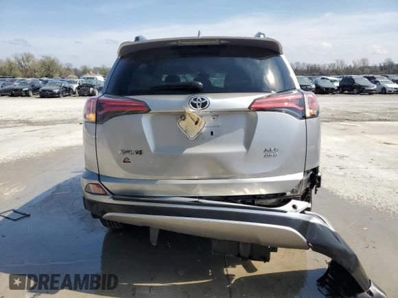 2018 Toyota RAV4 XLE with VIN 2T3RFREV3JW740122, listed as a Copart auction lot 51339045 with 115,293 mi miles and Salvage Title. Bid and sale history available at DreamBid. Image 6.