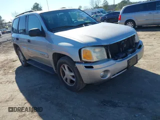 2004 GMC Envoy SLE with VIN 1GKDT13S642213710, listed as a IAAI auction lot 41680656 with 239,187 mi miles. Bid and sale history available at carsss.com. Image 1.