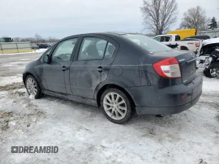 2011 Suzuki SX4 with VIN JS2YC5A44B6300171, listed as a Copart auction lot 87673685 with 116,483 mi miles and Salvage Title. Bid and sale history available at DreamBid. Image 2.