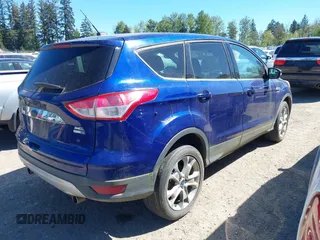 2013 Ford Escape SEL with VIN 1FMCU9HX3DUB97778, listed as a IAAI auction lot 42195445 with 147,154 mi miles. Bid and sale history available at carsss.com. Image 4.