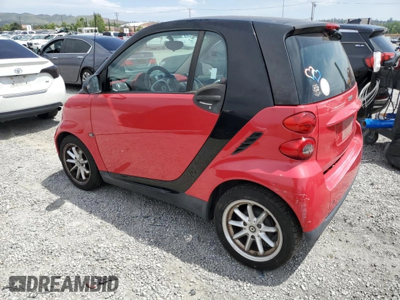 2009 Smart fortwo Pure z VIN WMEEJ31X89K291074, wystawiony jako Copart lot #56897635 z przebiegiem 145 504 mil mil oraz Czysty tytuł • Clean title. Historia ofert i sprzedaży dostępna na DreamBid. Obrazek 2.
